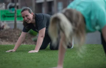 Woman doing Yoga in park with Y in the Community at YMCA of Greensboro
