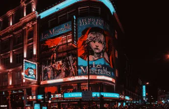 A photo of the musical Les Misérables on a theater display.