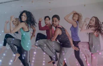Group of six participating in an upbeat zumba class