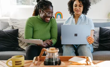 Two females looking at a computer.