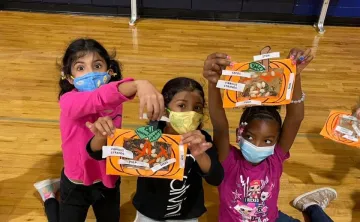 Girls participate in Thanksgiving crafts in the YMCA afterschool program.